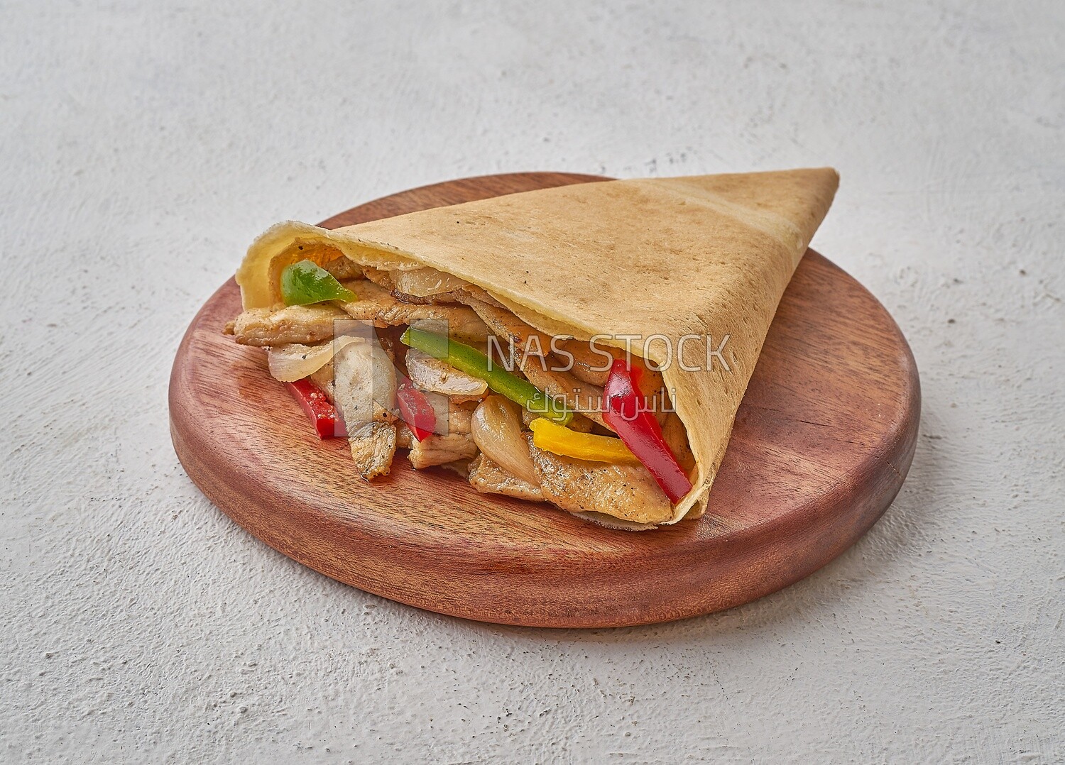 Grilled chicken crepe on a solid background
