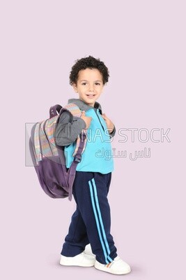 A boy wearing his bag
