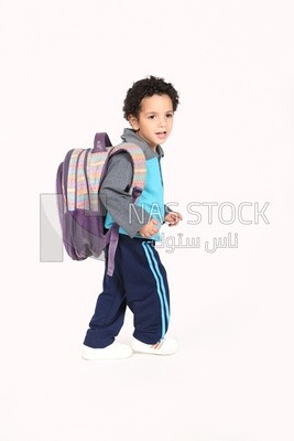 A boy wearing his bag