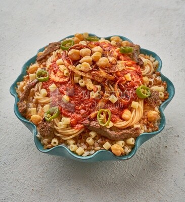 Top view of an Egyptian koshary dish with liver