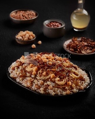 Egyptian Koshary with dishes of lentils and fried onions