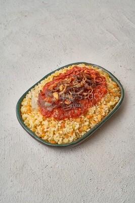Alexandrian Koshari with red sauce and fried onions