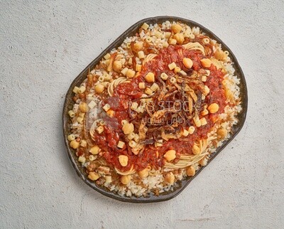 Egyptian Koshary with red sauce  on a solid  background