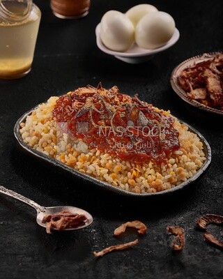 Alexandrian Koshary dish with red sauce
