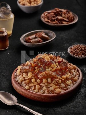 Egyptian Koshary with sausage and appetizers