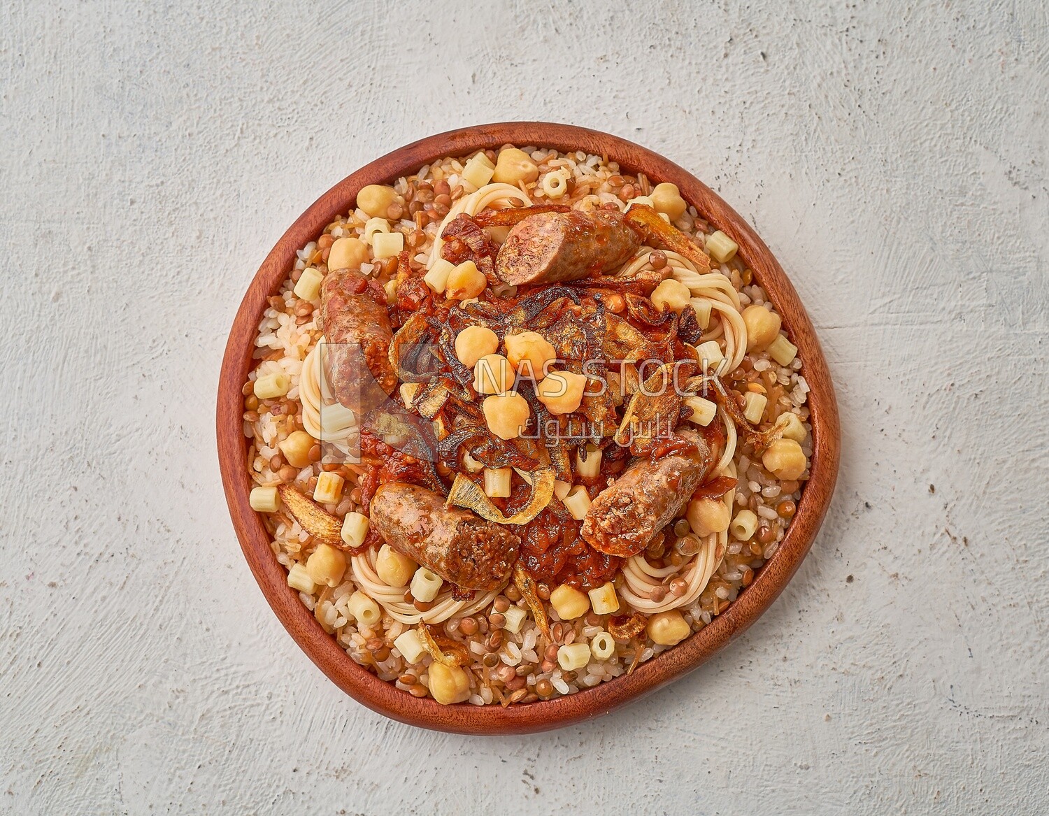 Egyptian Koshary dish with sausage on a solid  background