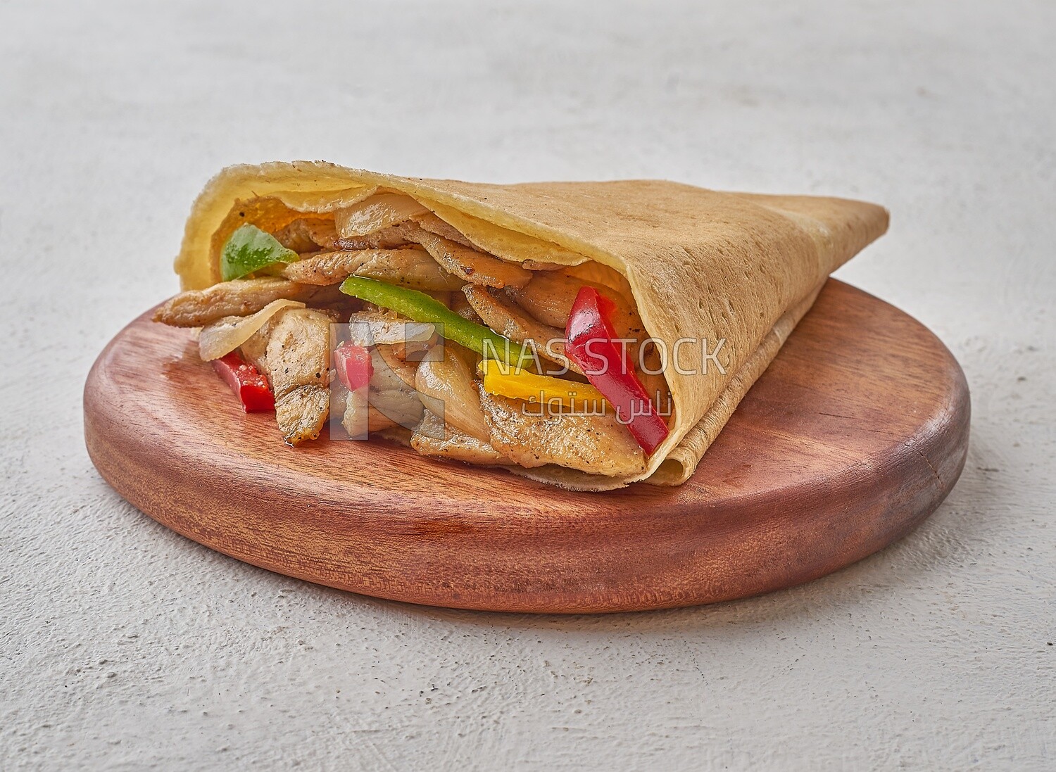 grilled chicken crepe on a solid background