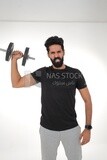 Saudi man Wearing sports clothes, exercising with dumbbells, bodybuilding, healthy lifestyle, building muscle, white background, Saudi model