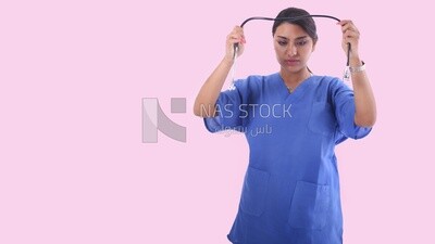 A woman doctor holding a stethoscope