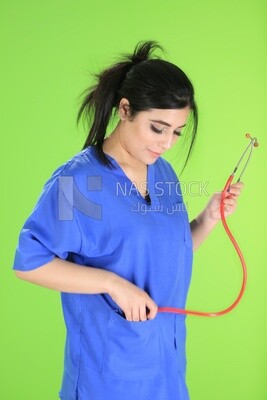 A woman doctor holding a stethoscope