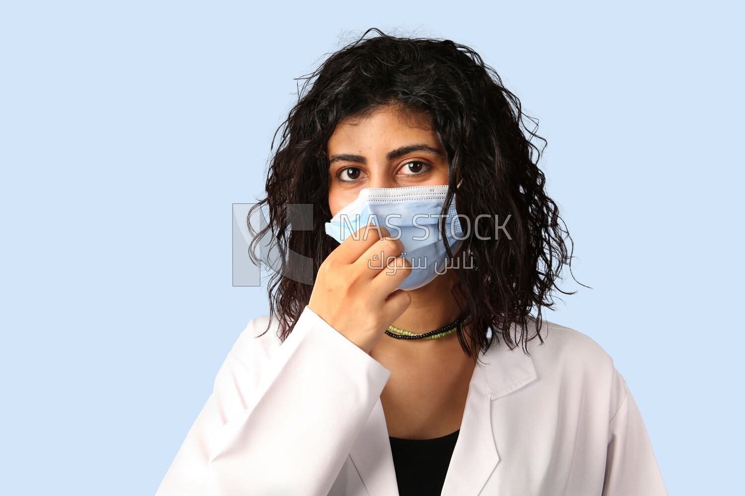A woman doctor wearing a mask