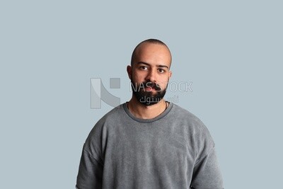 Portrait of a young man with a beard wearing a shirt