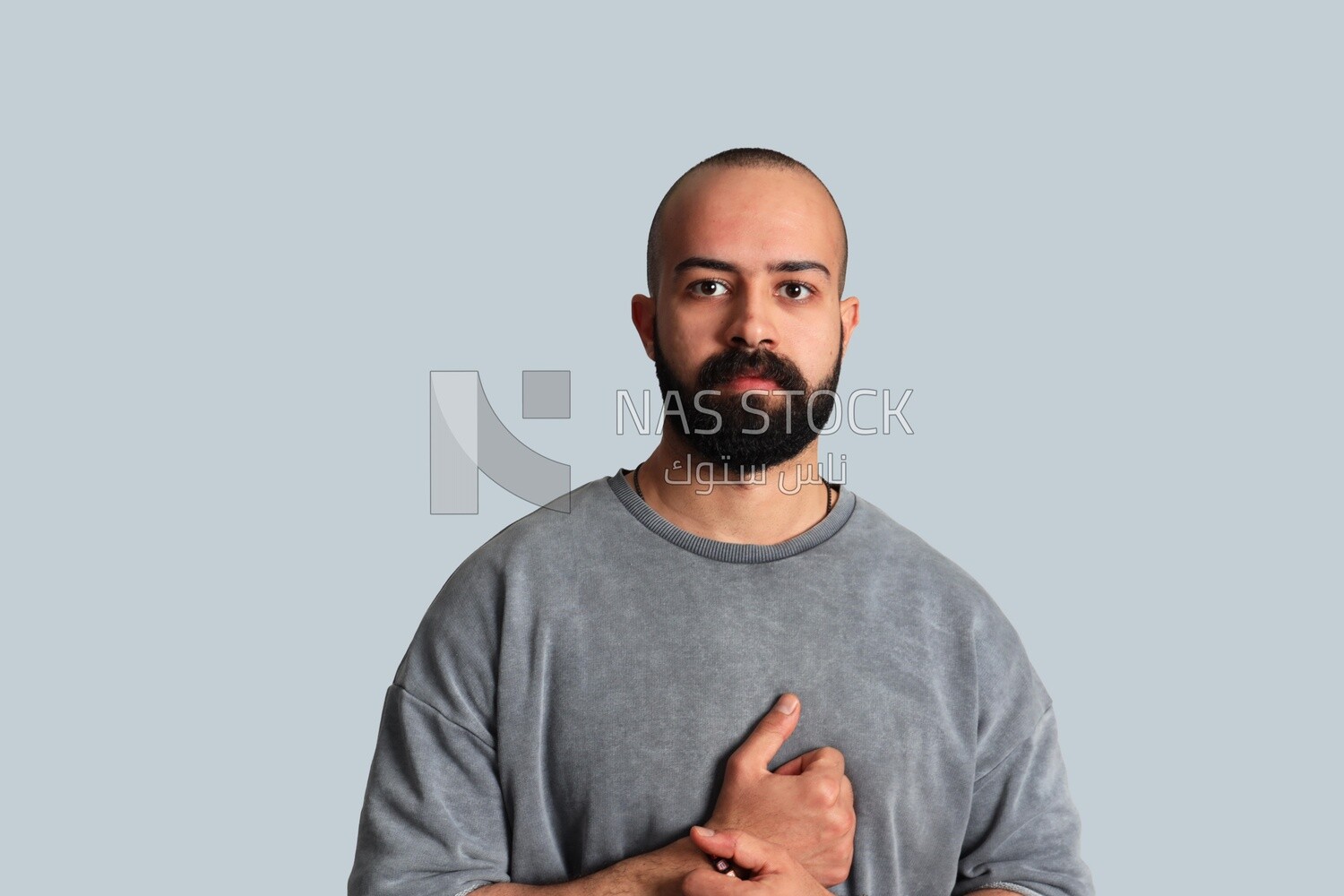 young man with a beard wearing a shirt