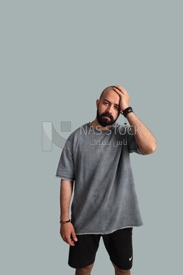 young man puts his hand on his forehead