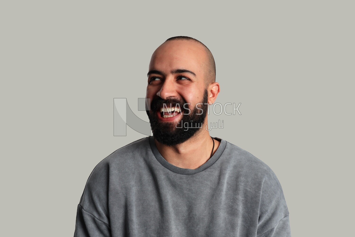 Portrait of a young man laughing happily