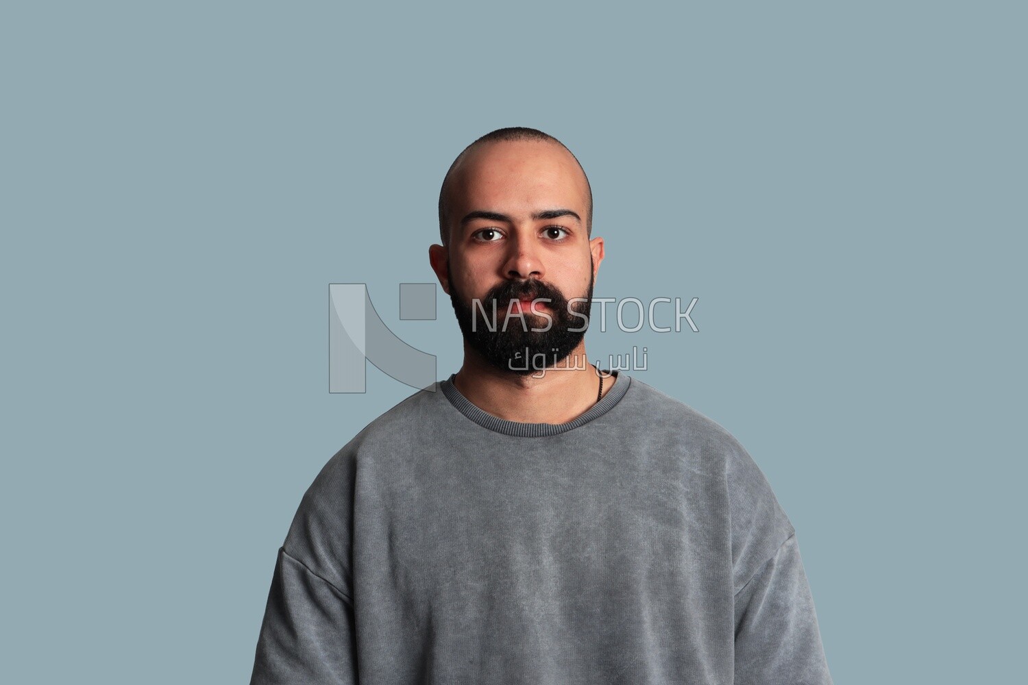 young man with a beard wearing a shirt