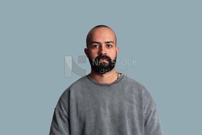 young man with a beard wearing a shirt