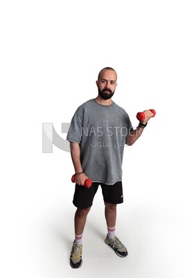 young man holding dumbbell