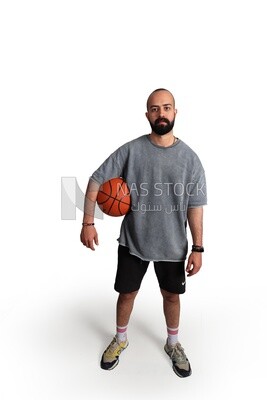 young man holding a basketball