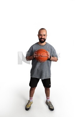 young man holding a basketball