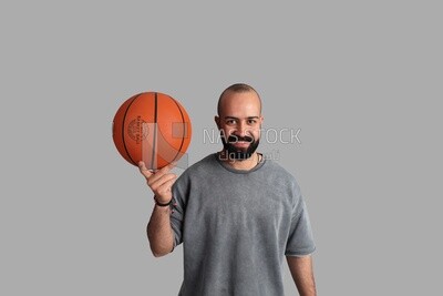 young man wearing sportswear and holding a basketball