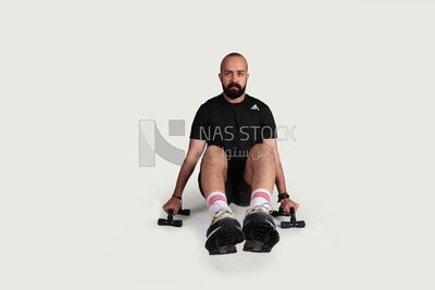 sportsman with gym equipment
