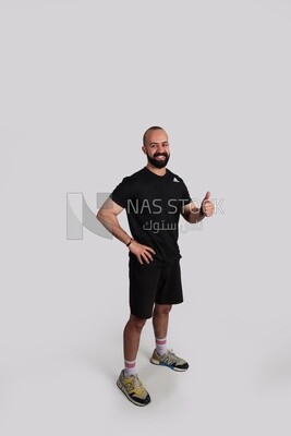 Coach with thumbs up