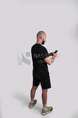 man in sportswear is making a call