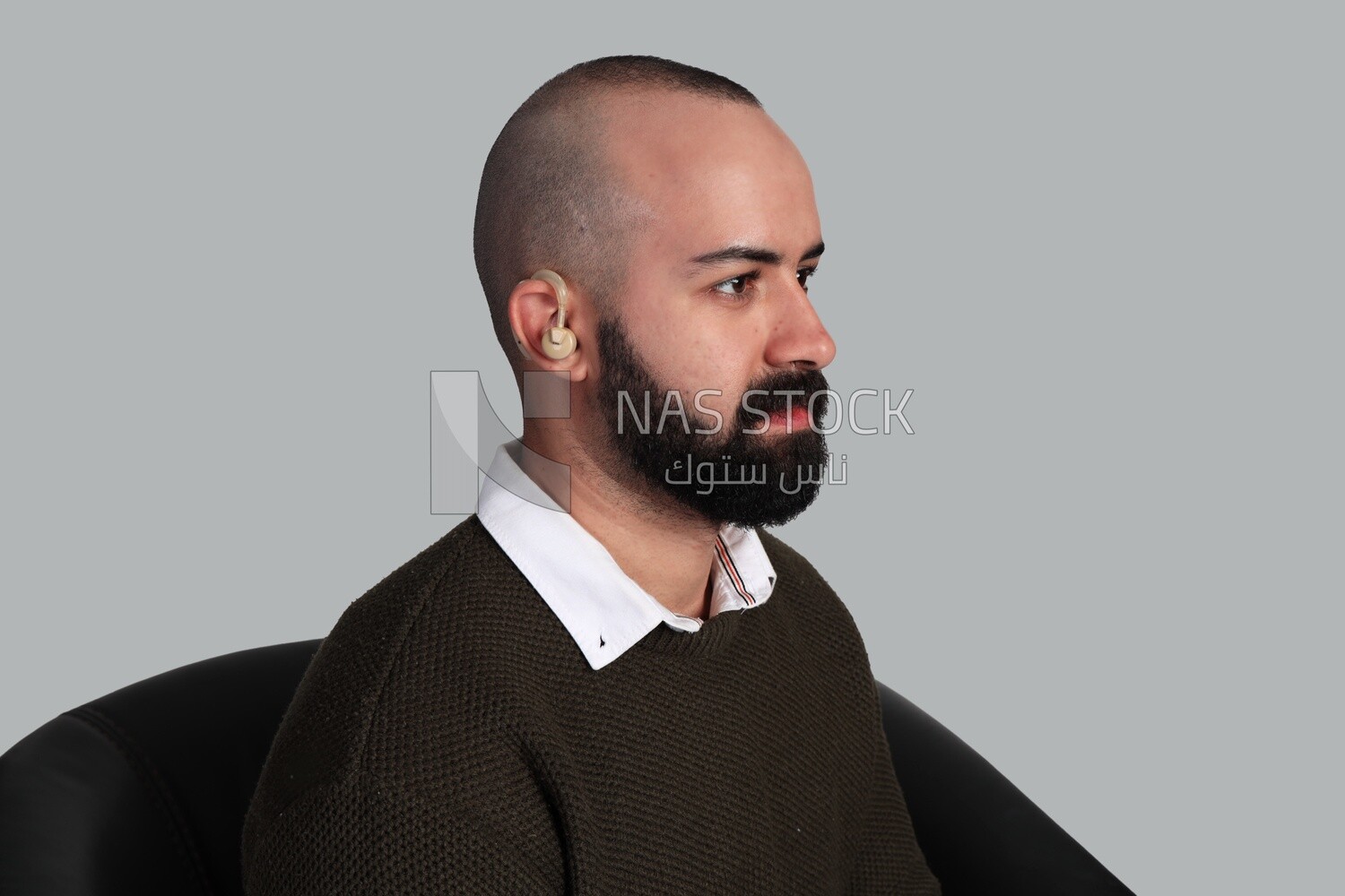 man suffering from hearing impairment