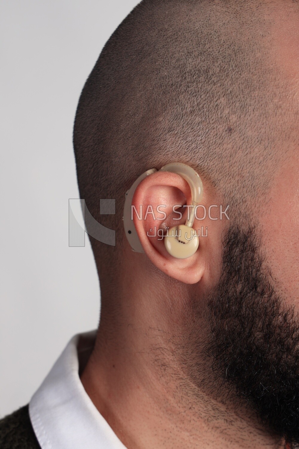 Close up of an ear with a hearing aid