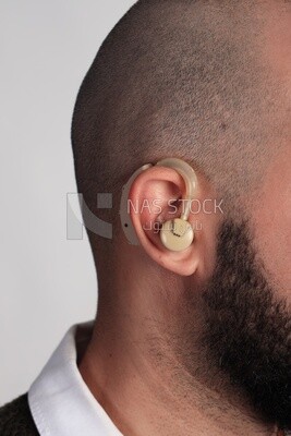 Close up of an ear with a hearing aid