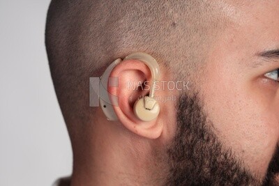 Close up of an ear with a hearing aid