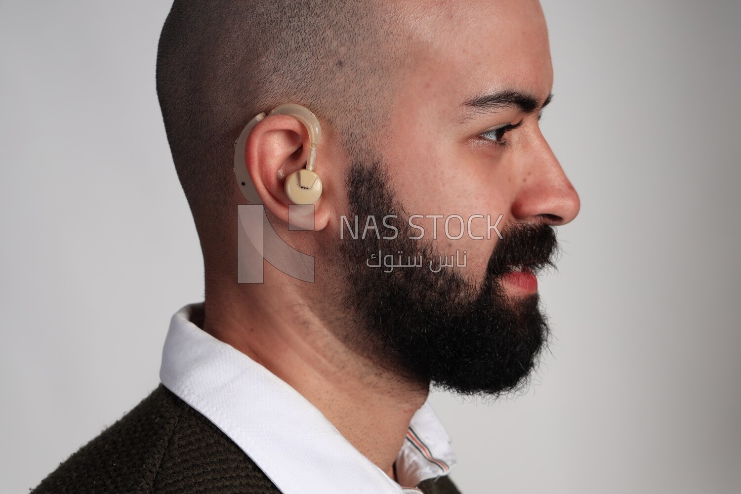 man wearing a hearing impaired earphone