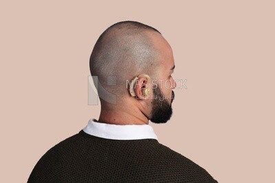 man suffering from hearing impairment