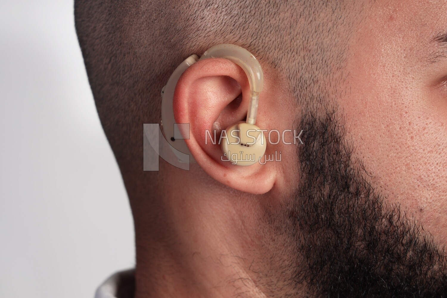 Man suffering from hearing impairment