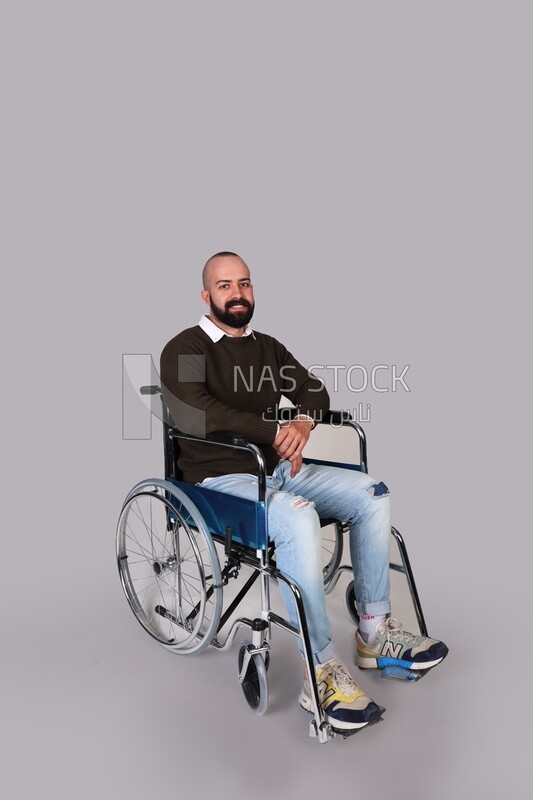 Disabled man in a wheelchair smiling positively