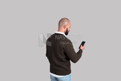 man looking at his phone