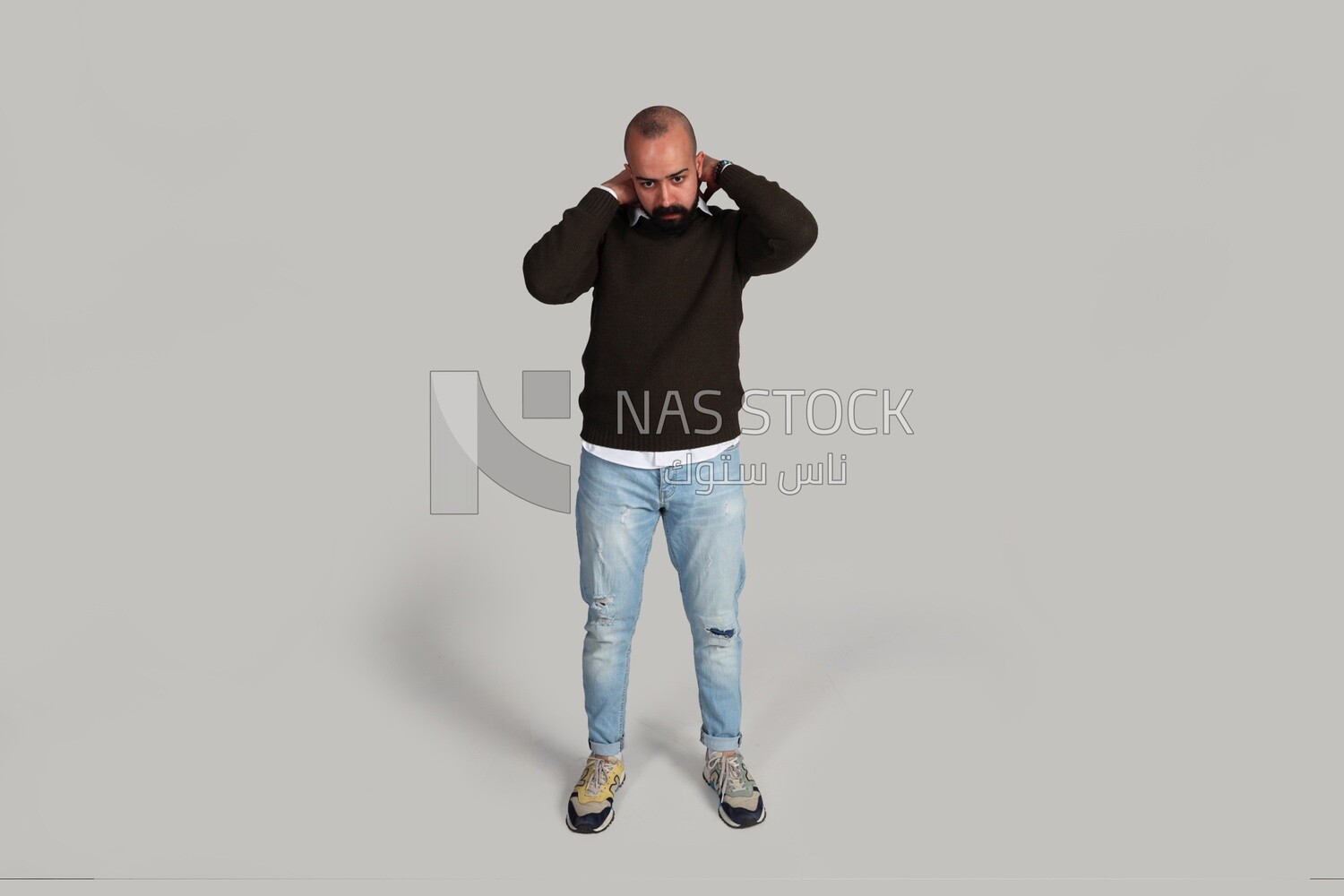 man arranging his clothes