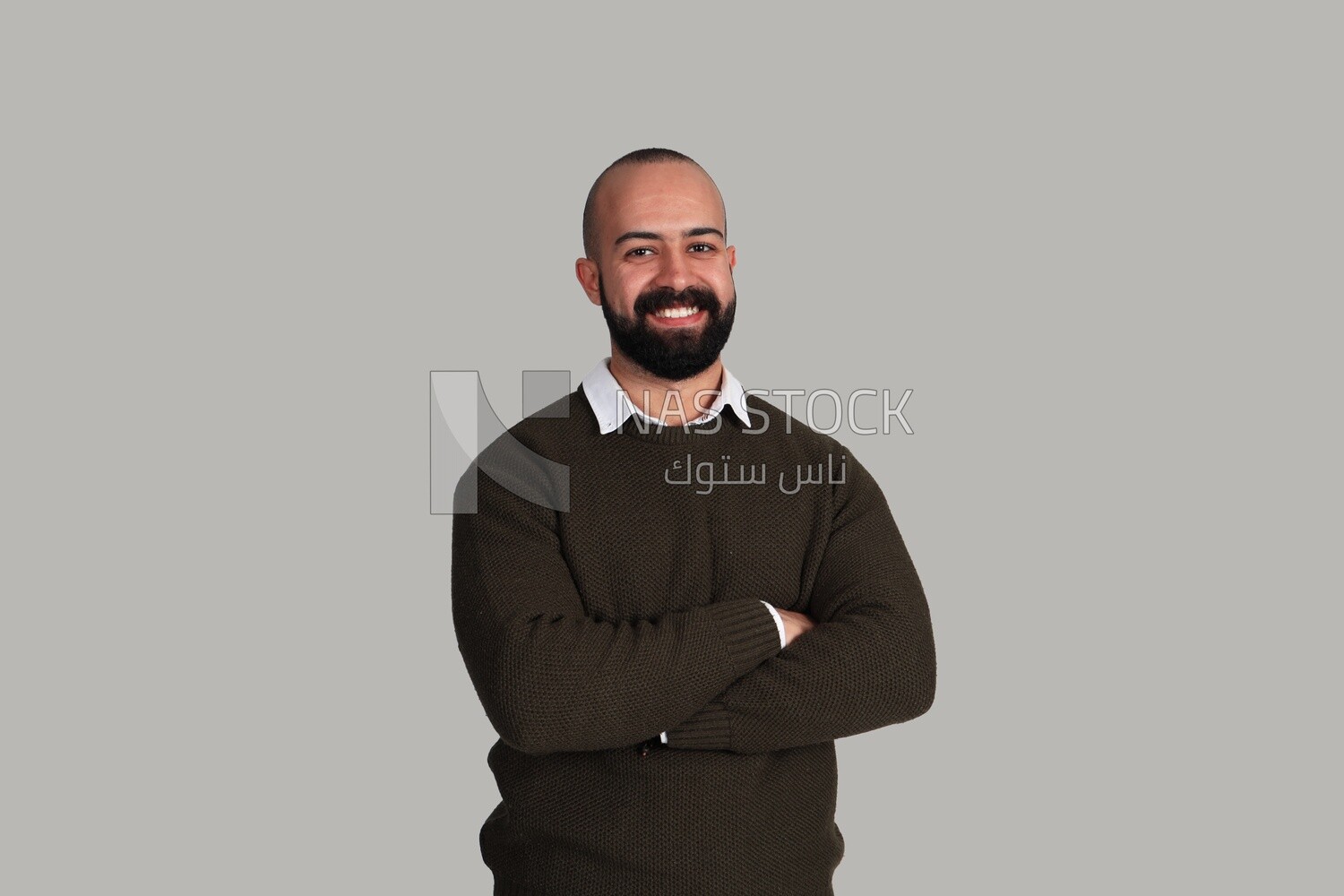 man clasping his hand across his chest