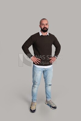man standing with hands on hips