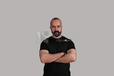 man clasping his hand across his chest
