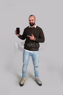 man pointing at his smartphone