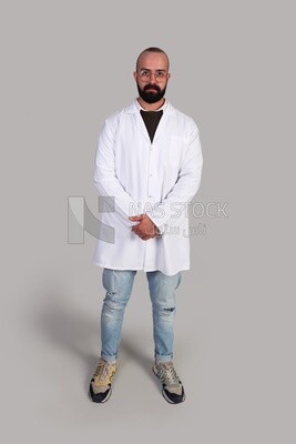 doctor with glasses standing and wearing a hospital uniform