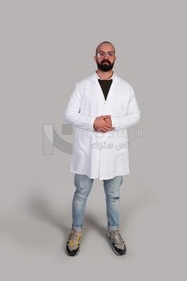 doctor with glasses standing and wearing a hospital uniform