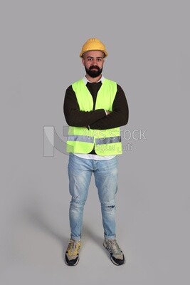 worker wearing a protective vest and helmet