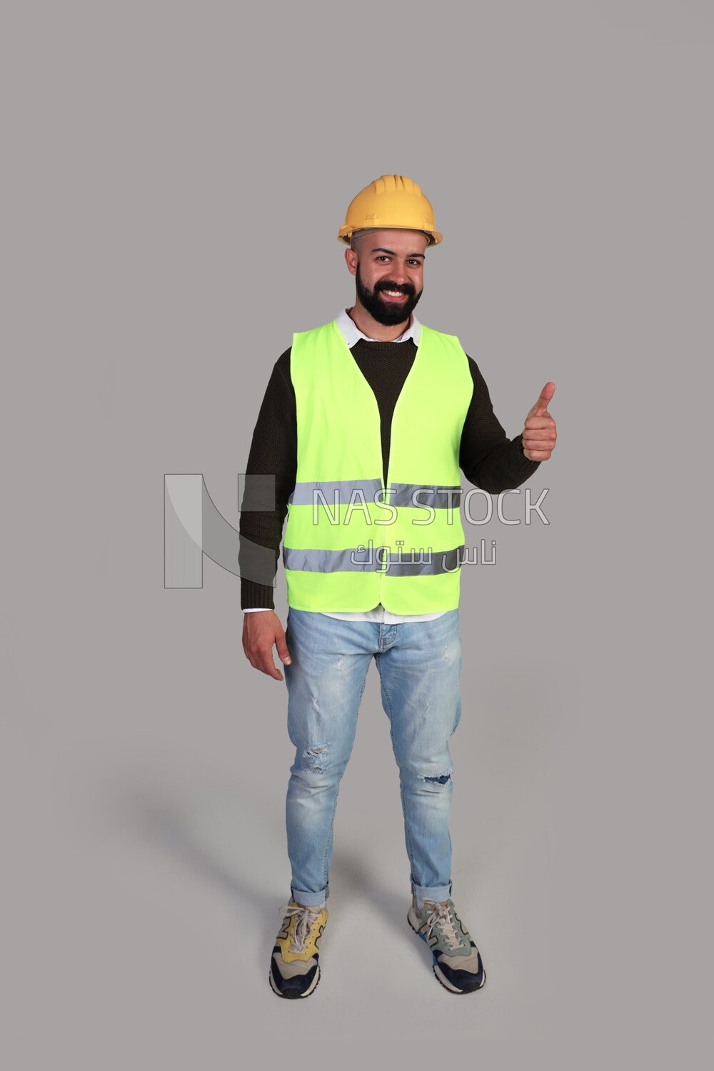 worker raising his thumb