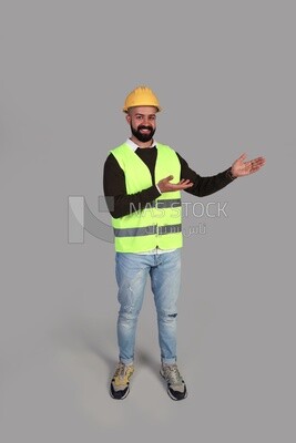 worker pointing to the right with his hand