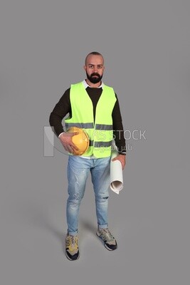 engineer in work clothes and construction maps