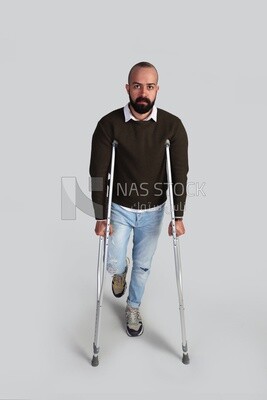 young man using crutches