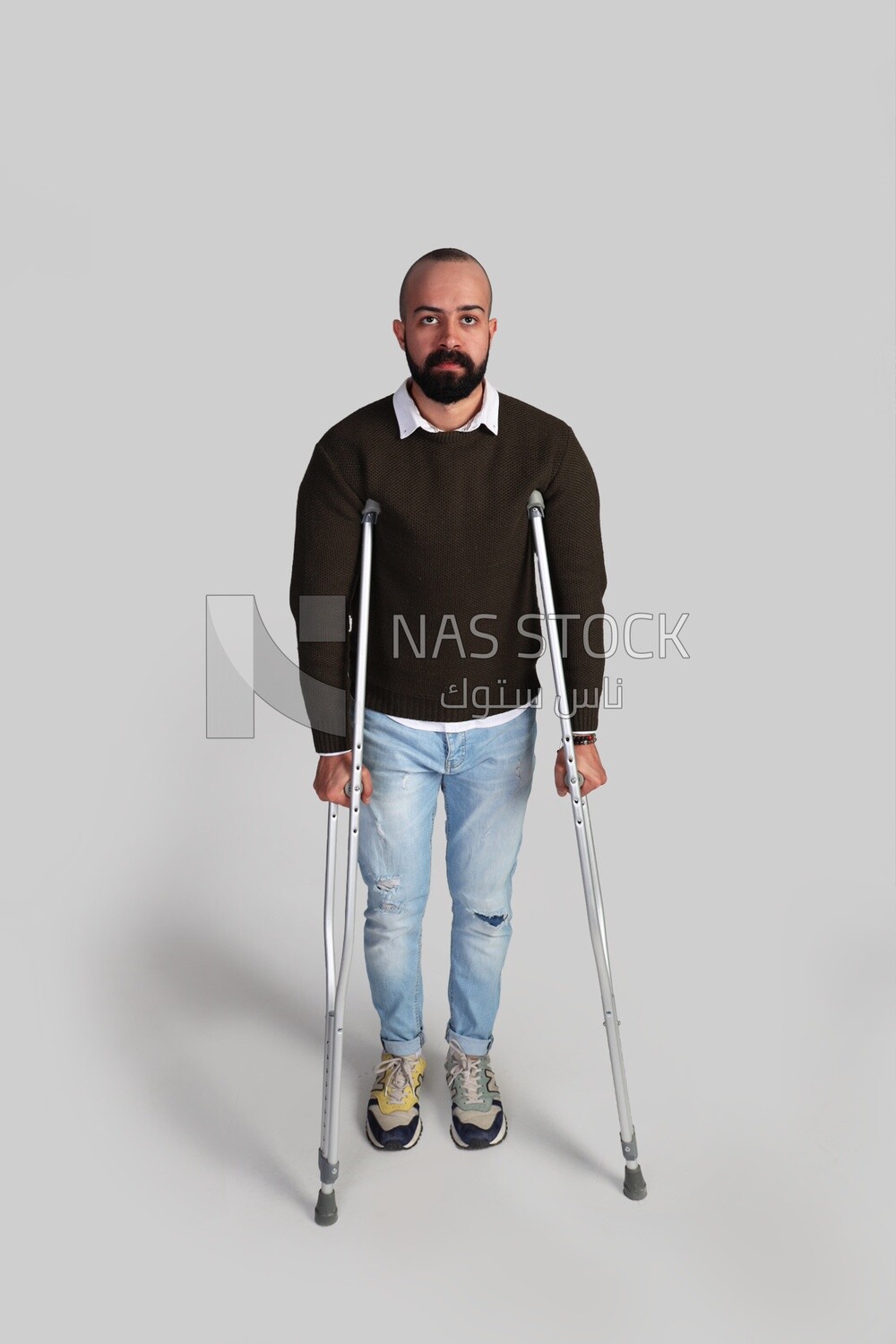 young man using crutches
